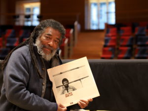 Wadada Leo Smith holding the 1978 Divine Love LP